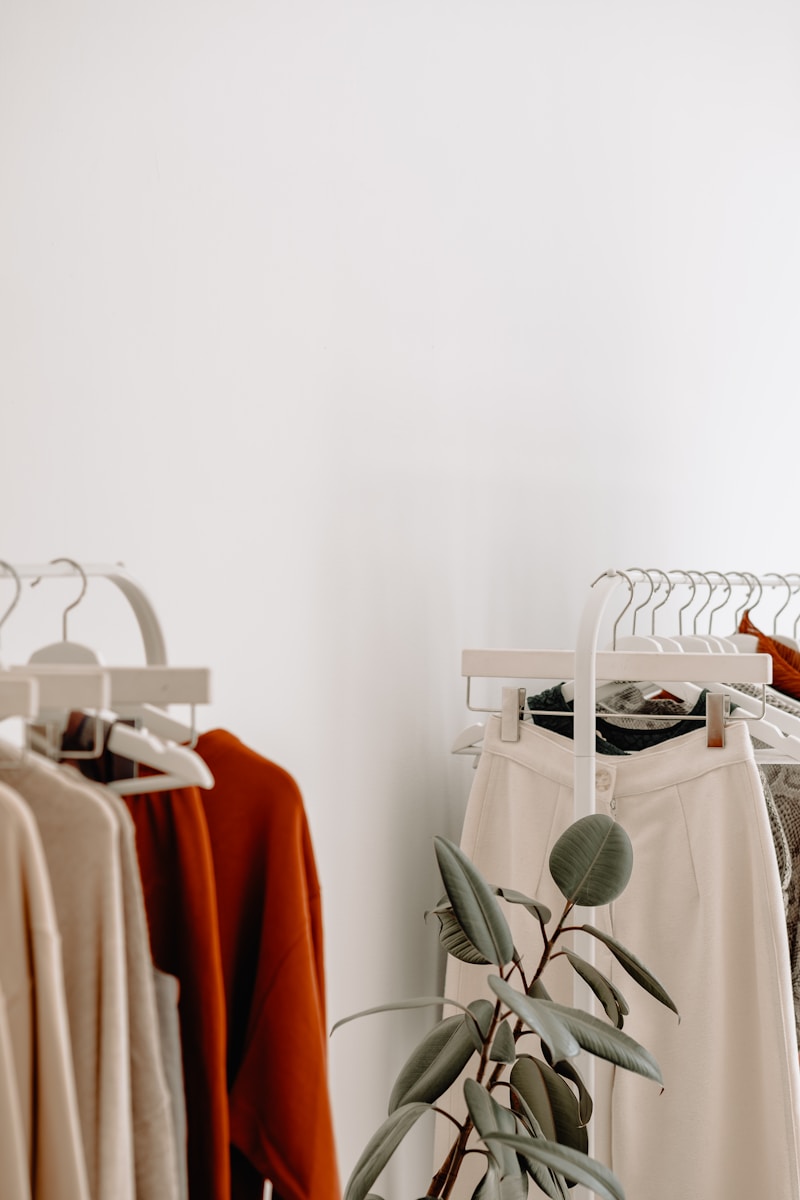 red and white long sleeve shirt, cloths hanging for editorial photoshoot styling